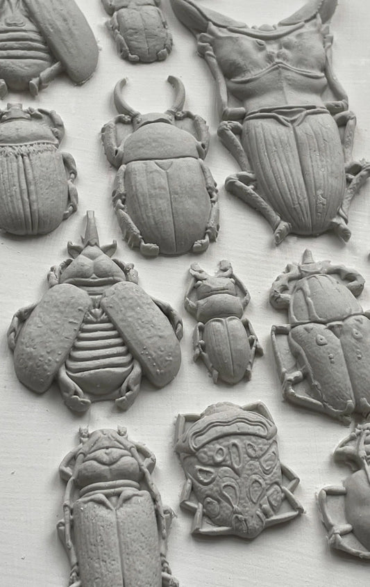 Bugs, beetles,IOD Moulds are the most beautifully designed, deeply detailed moulds on the market. They are made from food safe materials (do not use the same set for food and crafts), and can be used to transform and create baked goods, furniture, soaps, jewelry, and more!  You can use IOD moulds with a bazillion different mediums ( yes, we counted.), transforming your projects into masterpieces with ease!